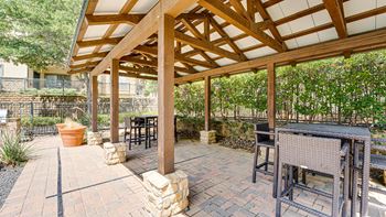 A patio with a table and chairs